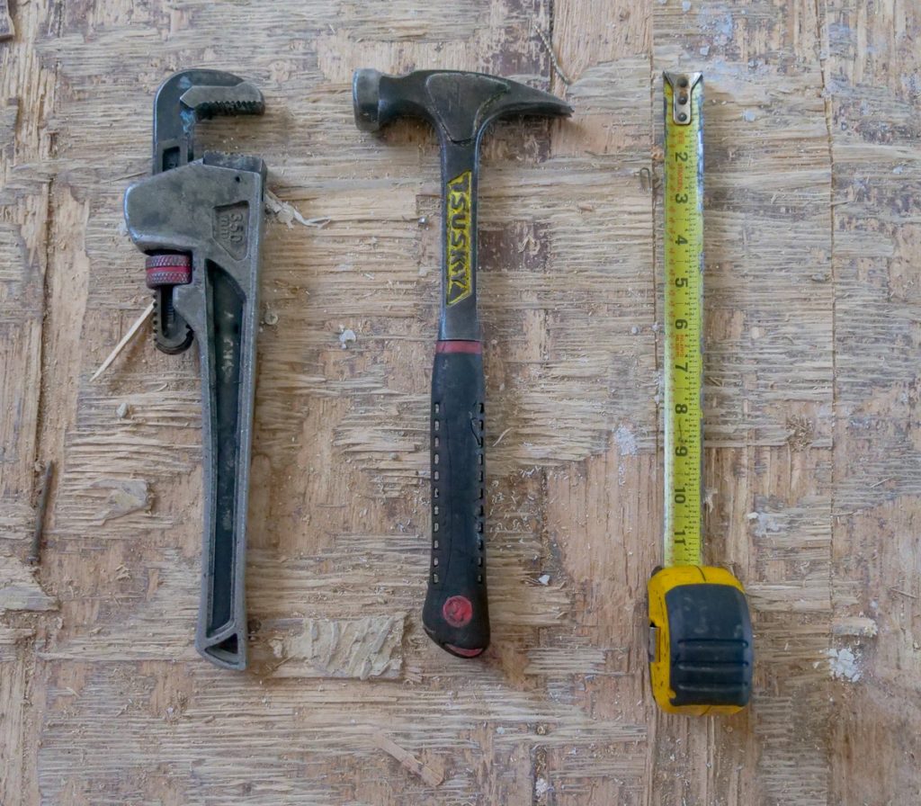wrench, hammer. and measuring tape