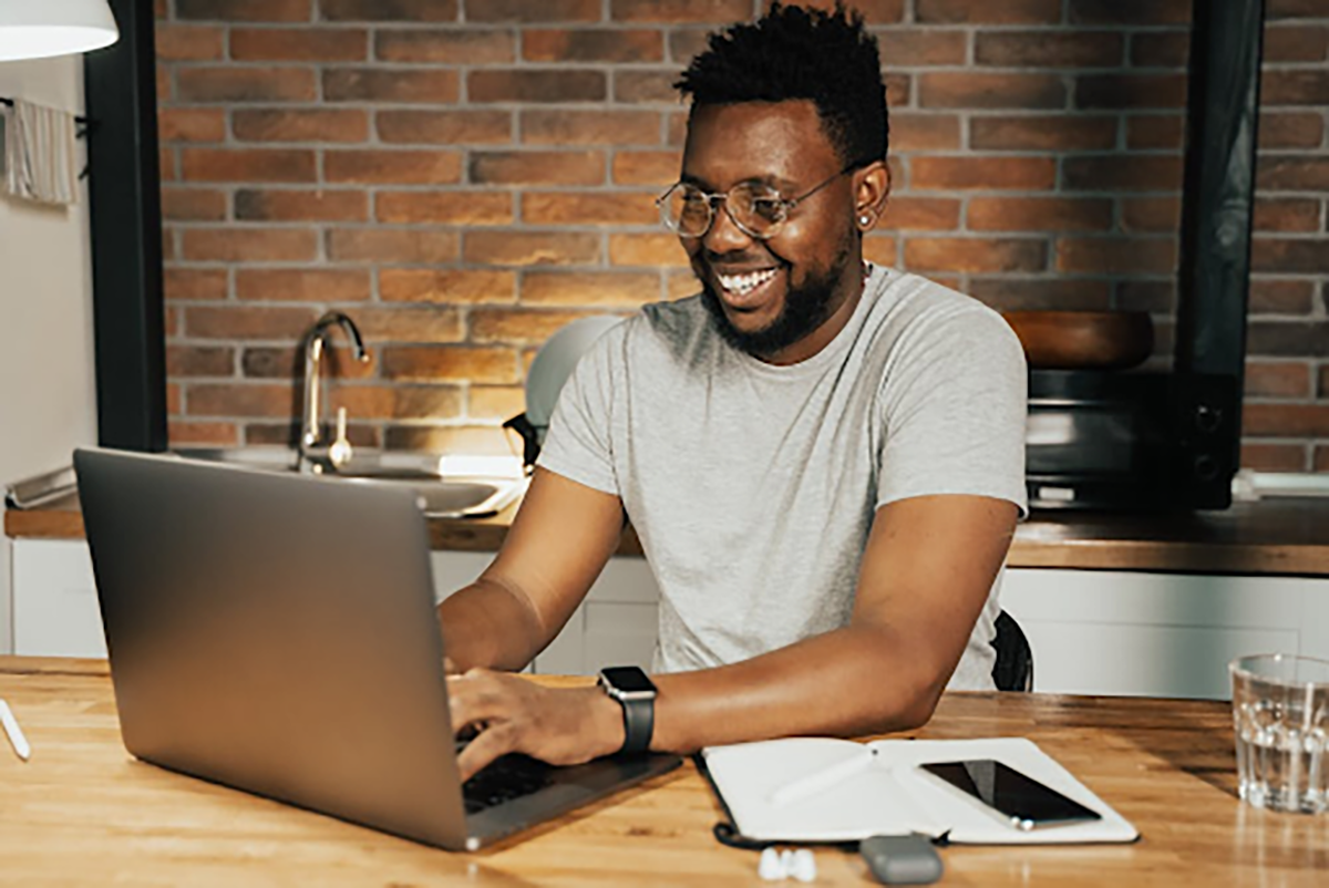 man on laptop checking out reviews