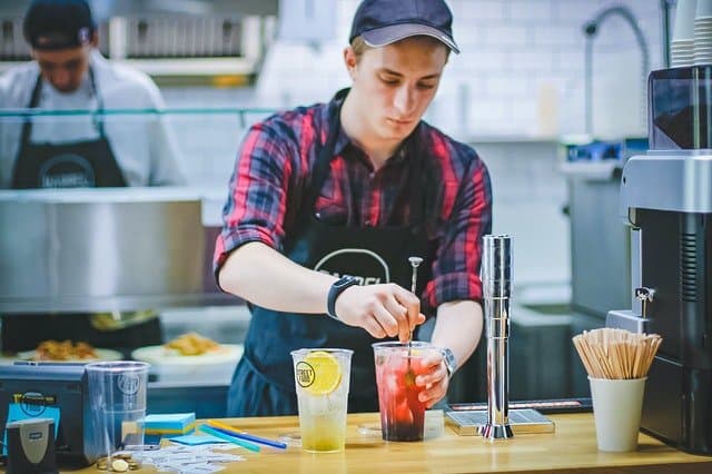 employee making cold drinks for customers
