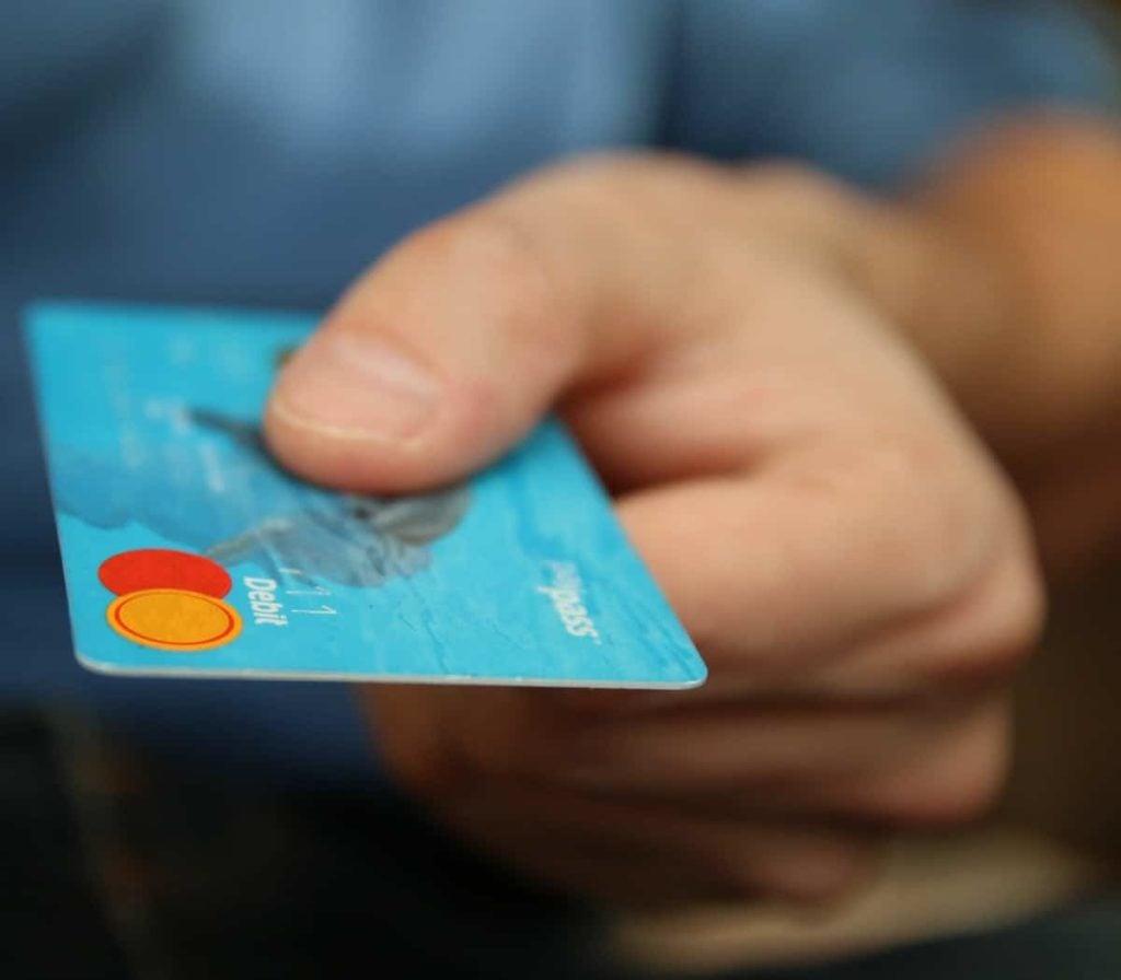 person holding credit card