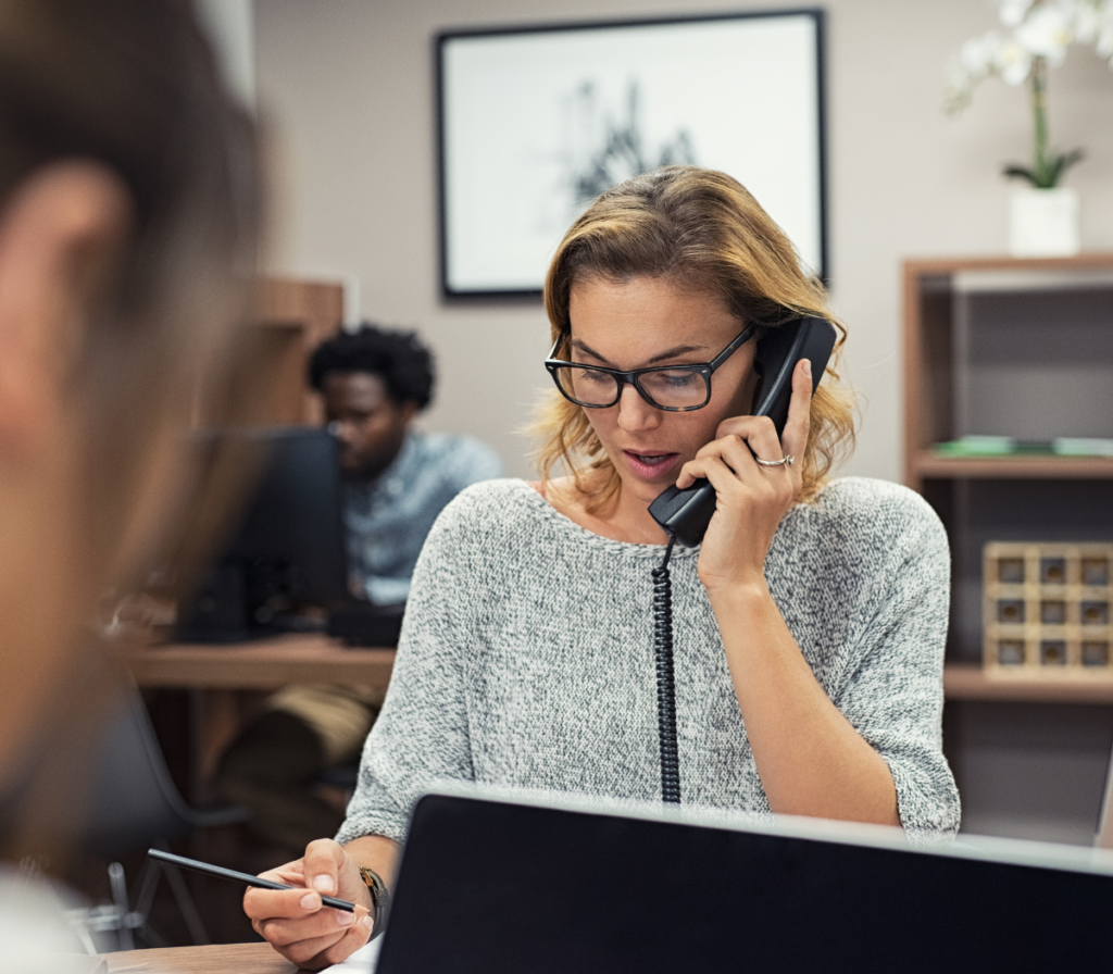 Woman on the phone with a customer