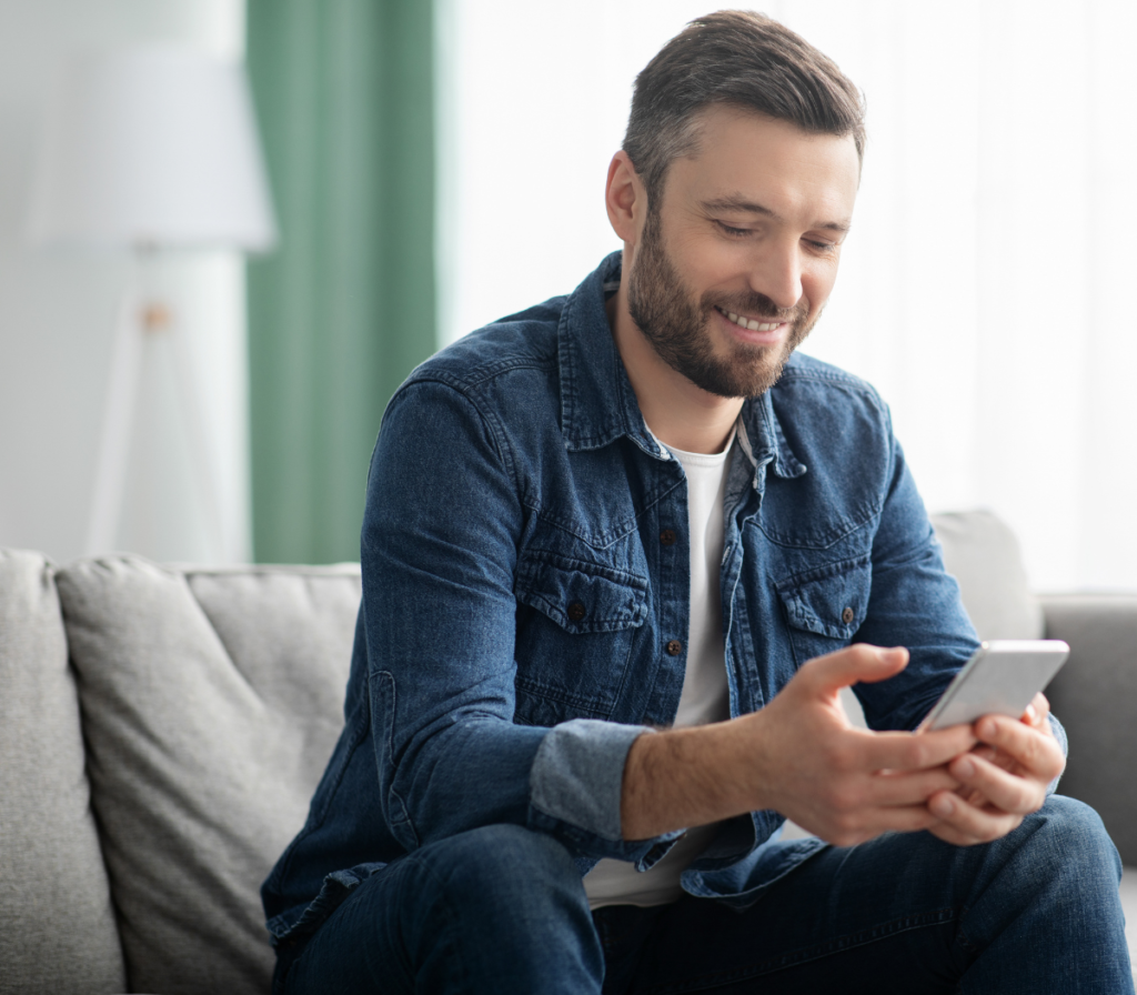  happy man texting a business