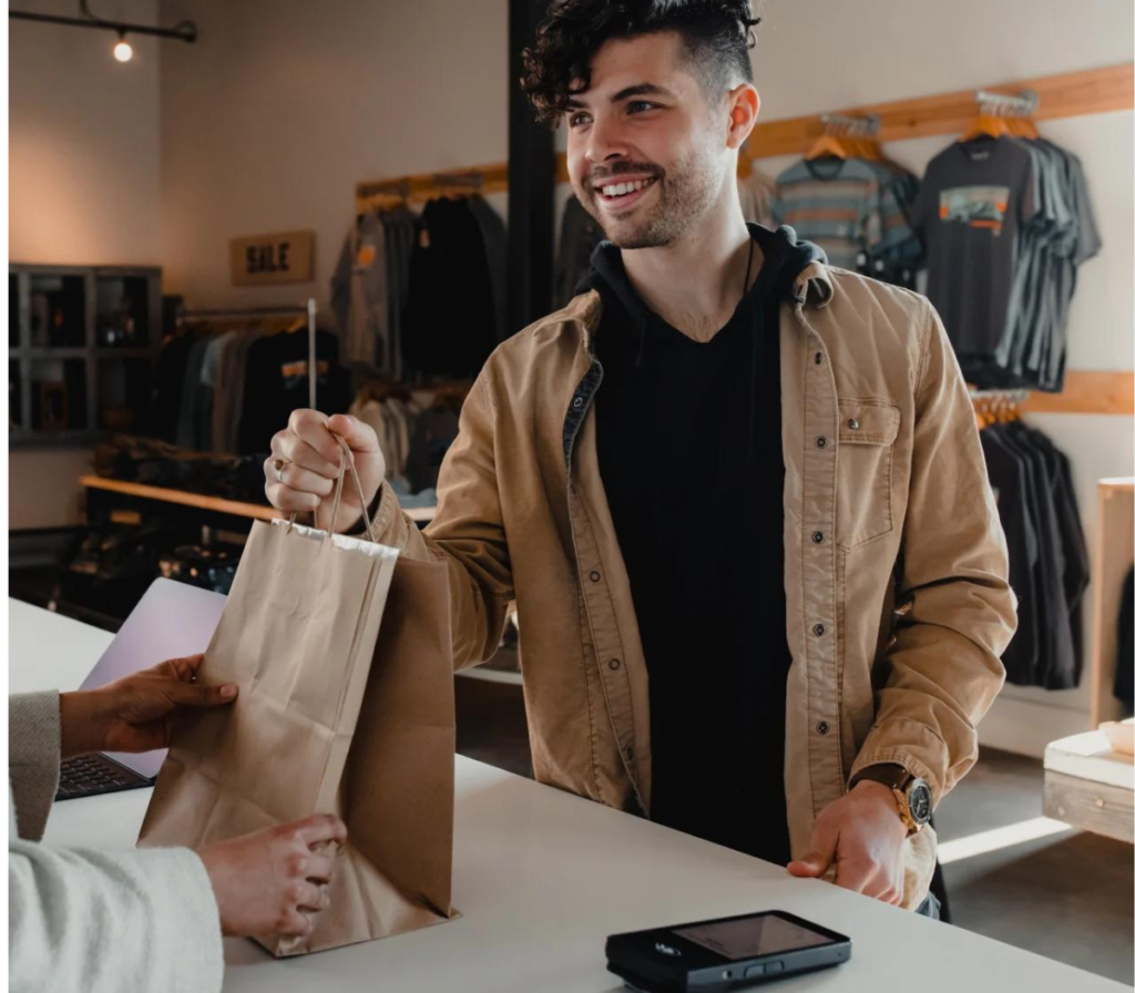 man paying for product