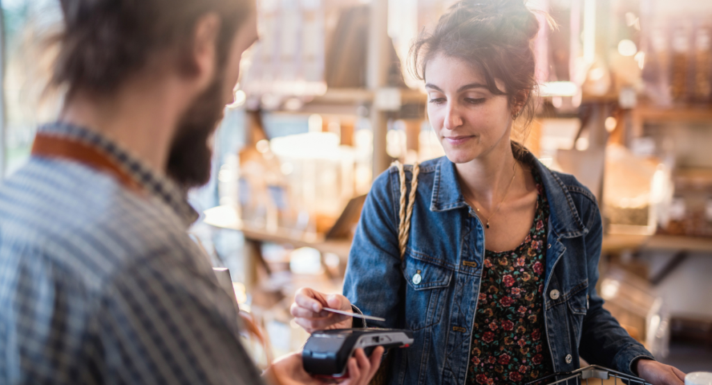 woman paying a small biz pos system