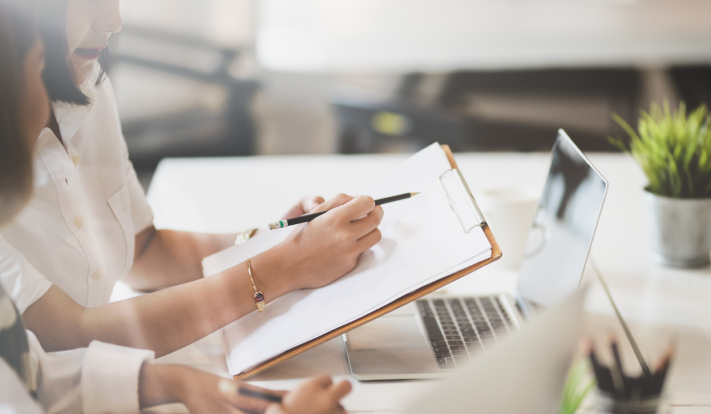 two people writing a business plan together